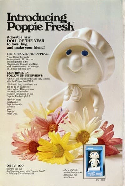 Vintage advertisement introducing the Poppie Fresh doll, surrounded by pink, yellow, and white daisies.